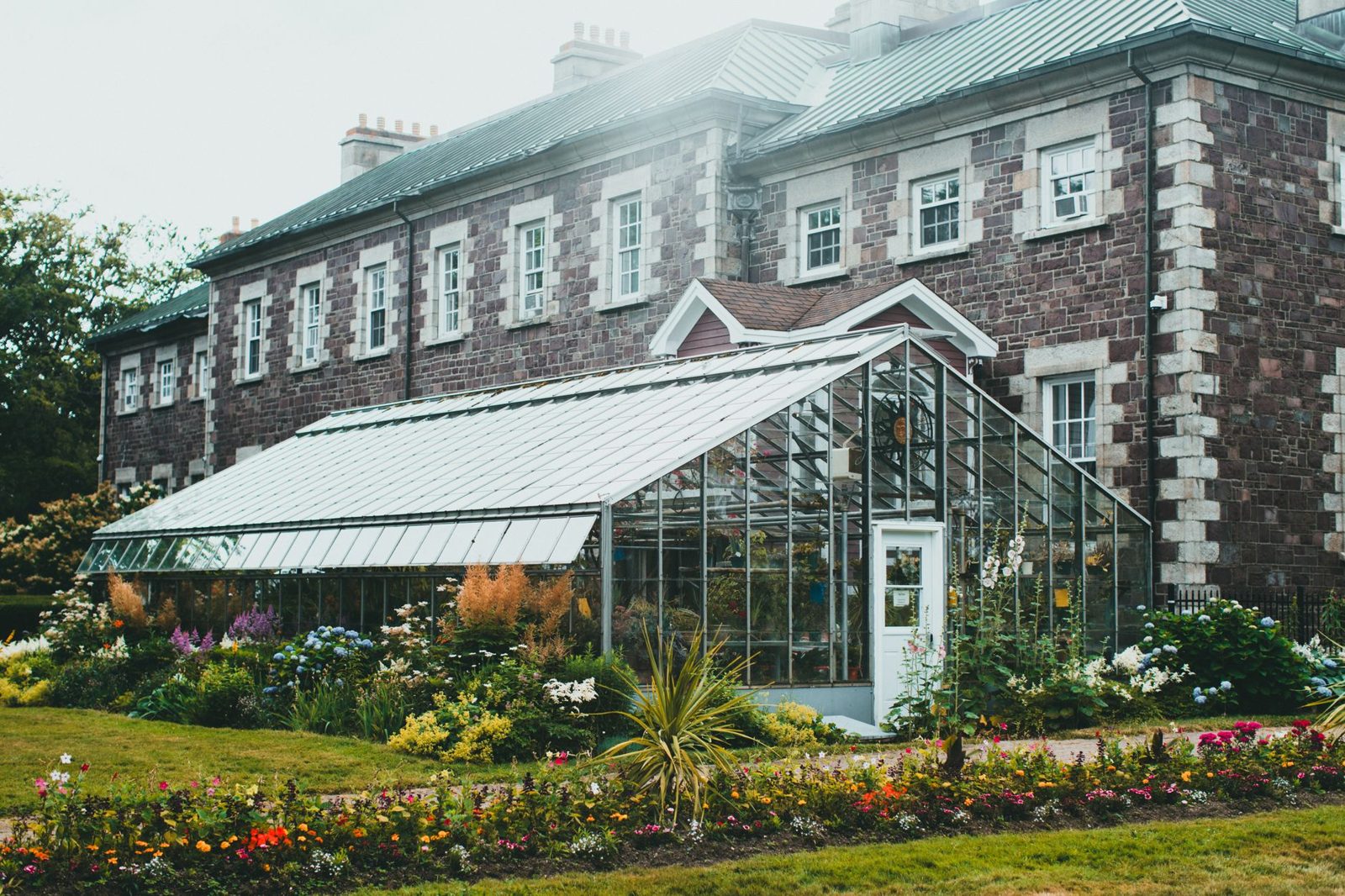 Brick house with a glazed extension